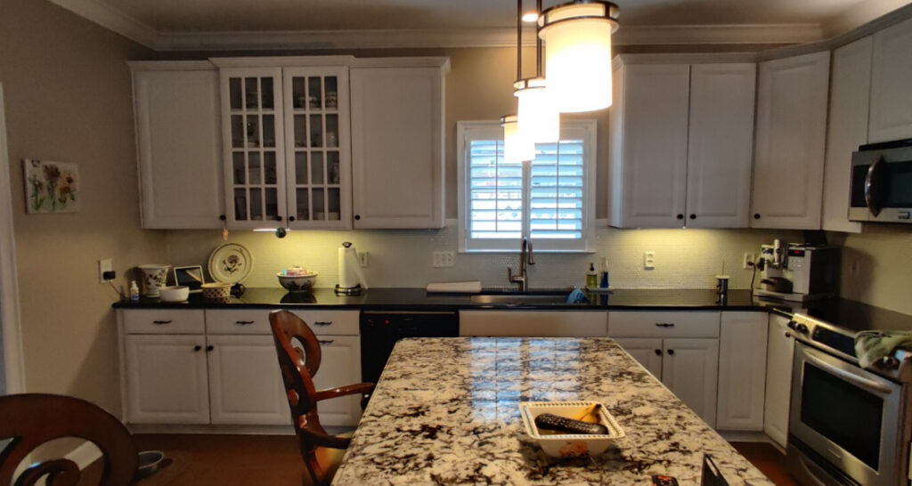 A "before" picture of an outdated kitchen.